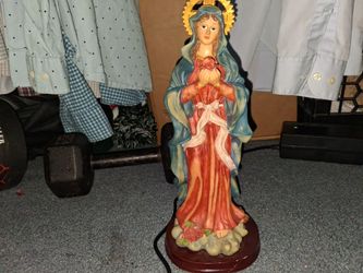 12 inch statue of Mary holding a red rose in her  hand