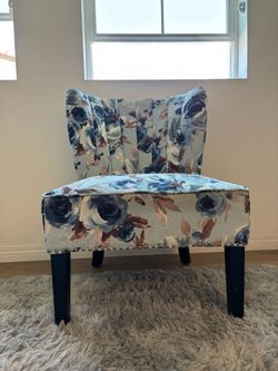 Blue and white floral print armless chair