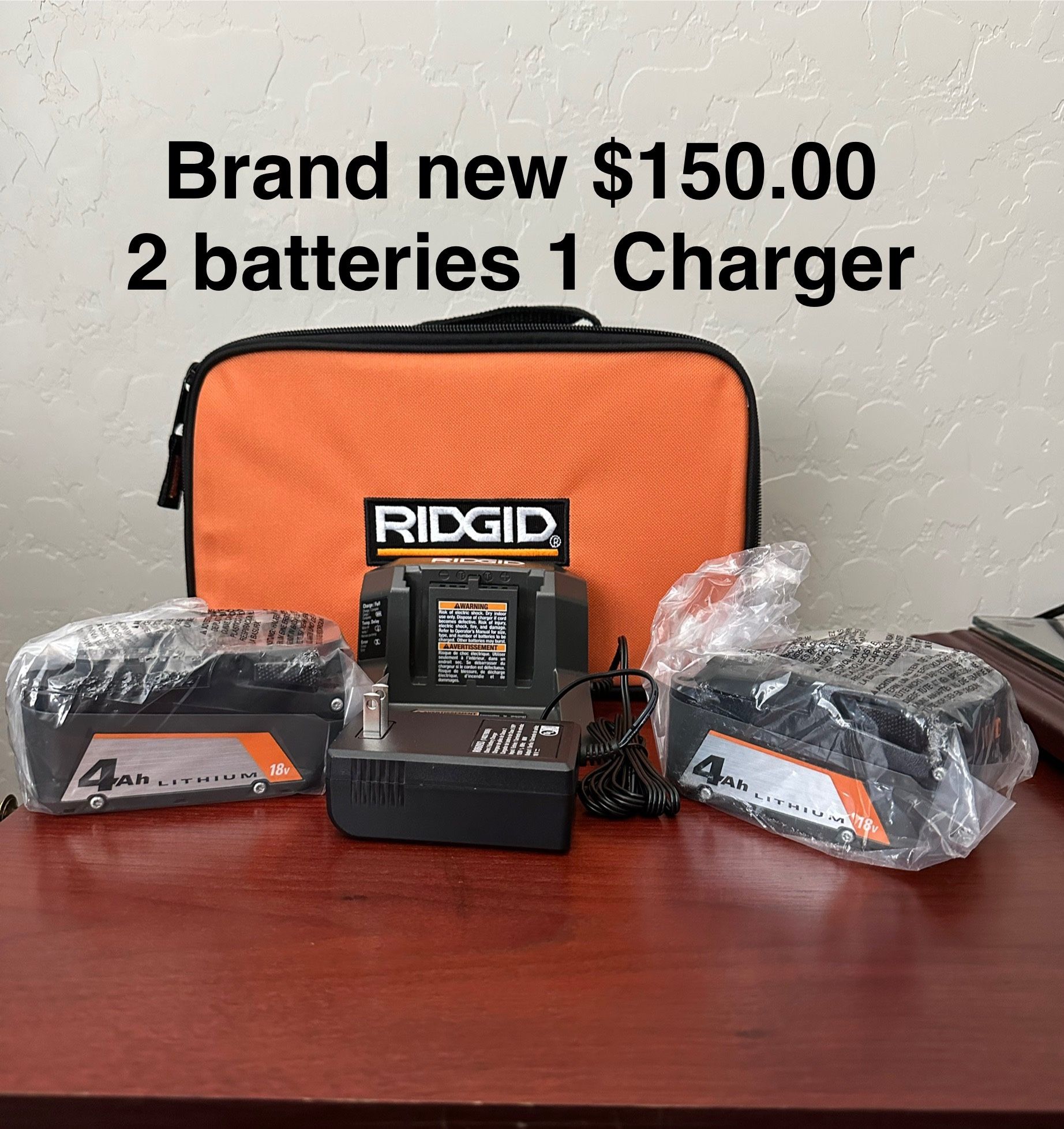 2 Batteries 1 Charger $150.00 New Plus A Soft Bag