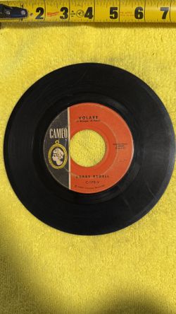 This collectible is a 1960 vinyl 45 RPM single by Bobby Rydell titled "I'd Do It Again" on the Cameo Records label. 