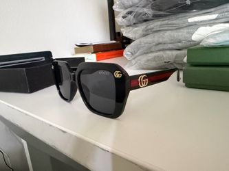 Gucci black sunglasses with red accents