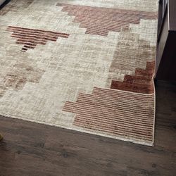 Tan/red Rug  6.5’ x 10’