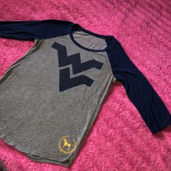 Victoria’s Secret Pink size medium WVU shirt. There’s some light piling at the armpits. See pic