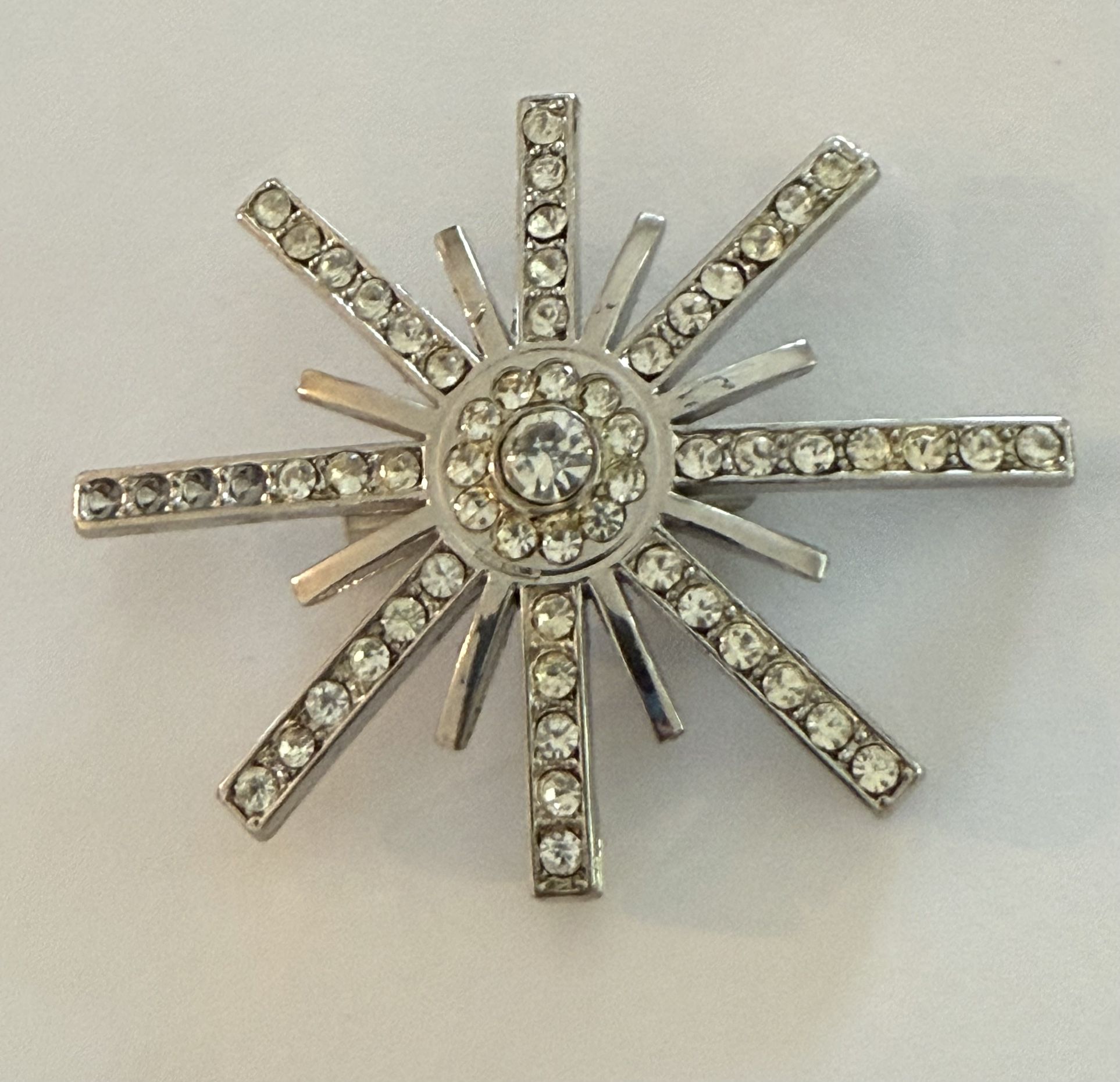 Elegant Silver Starburst Brooch