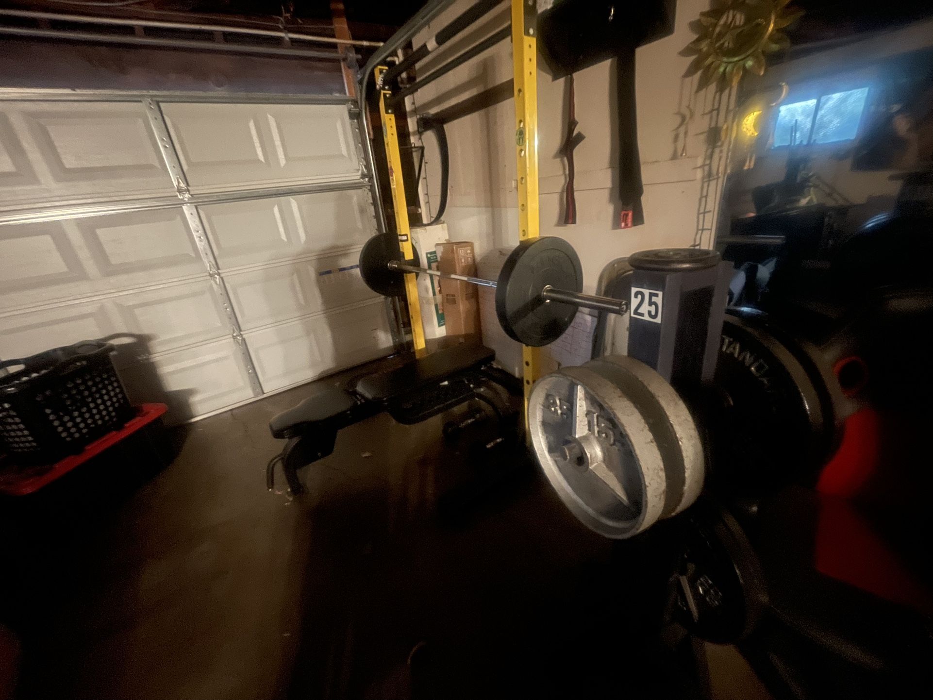 GARAGE WEIGHT LIFTING SETUP. BARBELL WEIGHTS BENCH RACK