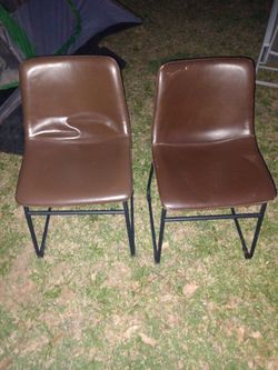 Pair of brown leather chairs