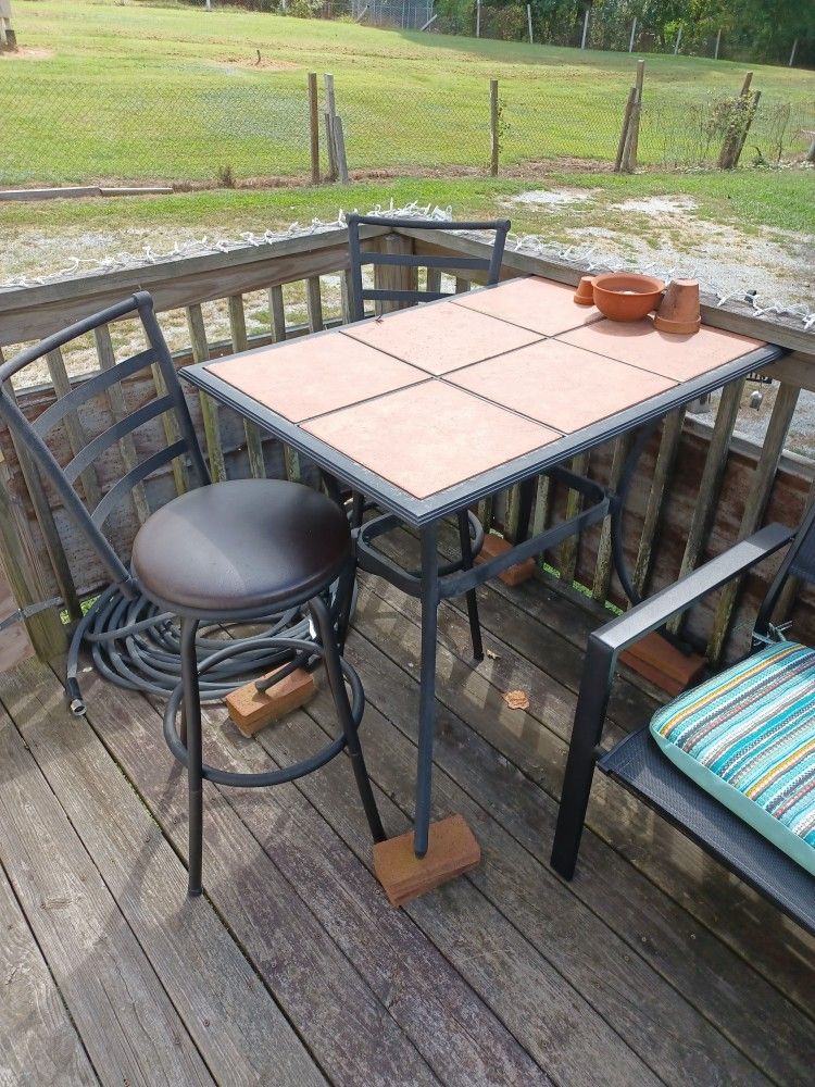 Two Swivel Bar Stools and Table 