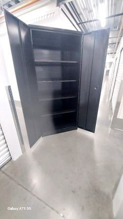 Metal "SteelCase" Brand Office Cabinet. In Excellent Condition. Extra Tall 80"1/2 . 5 Levels of Storage. Delivery Available.