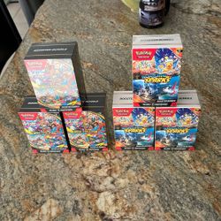 Pokemon Surging Sparks And Mega Evaluation Booster Bundle