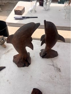 Hand carved dolphins