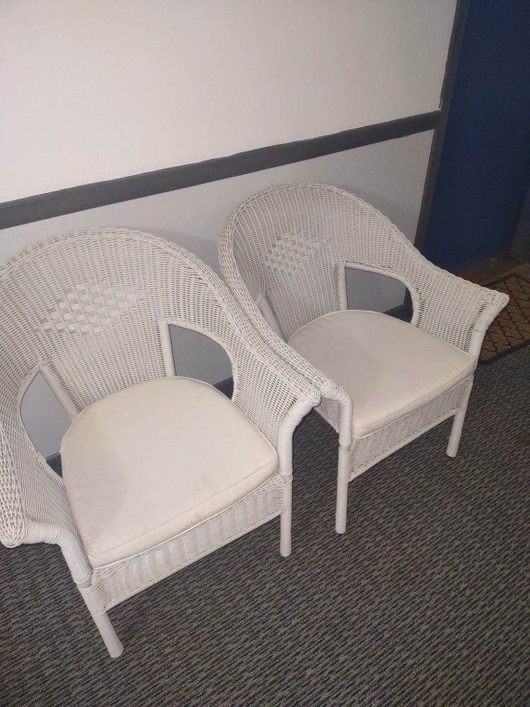 Two White Chairs With Cushions 