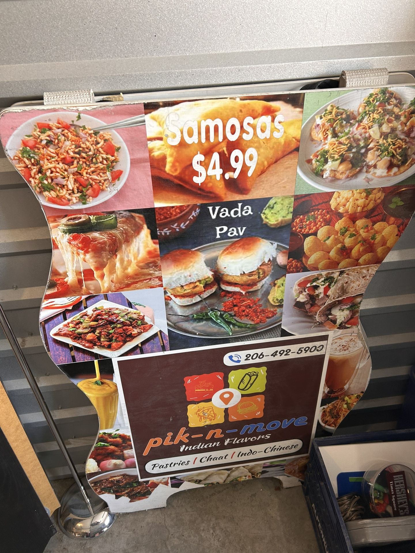 A board For Sale Currently Has Indian Food Prices On It