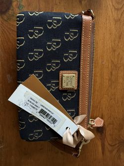 Dooney & Bourke Large Slim Wristlet.   NEW!!!