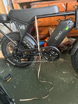 2 E bikes one big one small one and a free trek bicycle