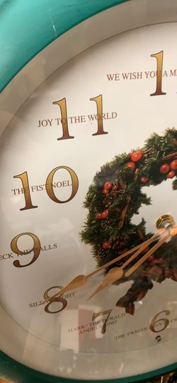 Battery operated Xmas clock plays 12 different Xmas songs