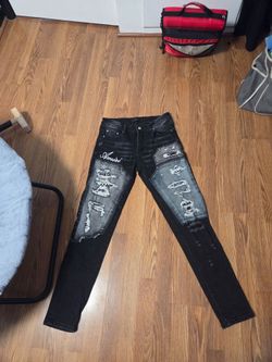 Black ripped distressed amiri skinny jeans