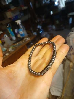 black or gunmetal-tone rhinestone stretch bangle bracelet. 