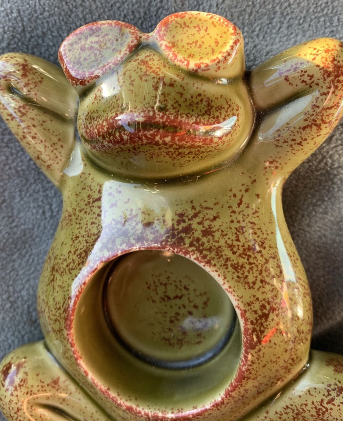 Frog candle holder. New. Comes with a new package of tea light candles of 12