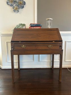 Vintage Wooden Secretary Desk with Fold-Down Writing Surface.