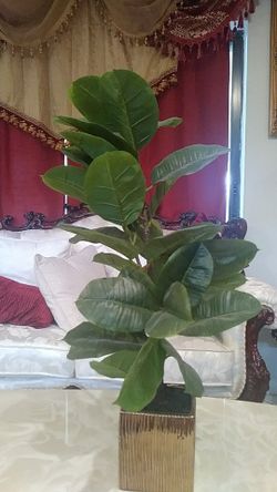 Nice gold color vase with artificial plant