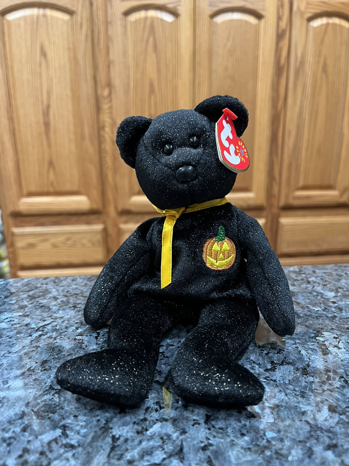 Ty Beanie Babie “Haunt” . year 2000. Size 7 inches tall. Sits up. Brand New with Tags has been on display in a cabinet with