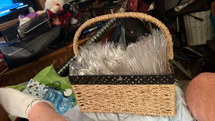 Wicker basket full of plastic silverware