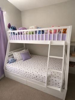 White bunk bed in good used condition and well maintained. Includes top bunk, larger bottom bed, ladder, and spacious storage drawers underneath. Grea