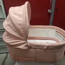 Pink baby bassinet
