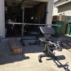 Adjustable bench squat rack combo with 300lb Olympic weight set