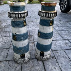 Set of 2 fiberglass lighthouses. These are a project. 1 has a hole See all pictures 