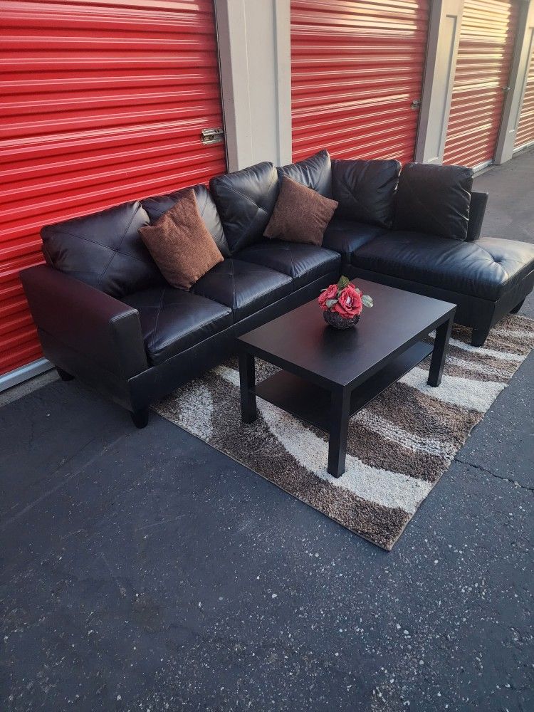 *Free delivery* Black right side sectional leather couch w/ long coffee table accent pillow and rug