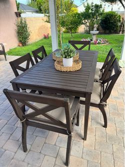 Outdoor wood table set with 6 chairs