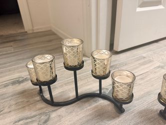 S-curve wrought iron table candle holders featuring mercury glass/trellis-pattern tea light votives (holding 5 tea light candles each).