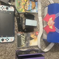 NINTENDO SWITCH BLUE AND RED CONSOLE W/ GAMES AND CASE