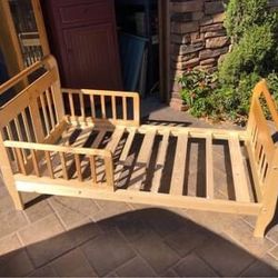 Child’s wooden bed 29” wide 55” long 28” high
