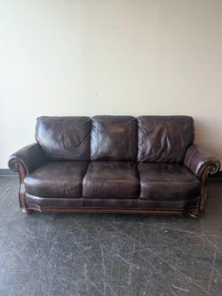 Classic Burgundy Leather Three-Seater Sofa with Rolled Arms