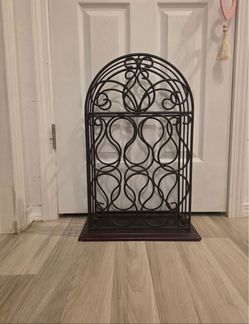 Ornate 24" tall wine holder, holds 10 bottles, $25