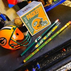 NFL. GREEN BAY PACKERS STATIONARY: Helmet tape dispensor, note pad, 2 pencils & pen, firm.