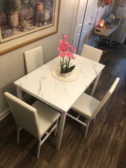 Like new white faux marble dining table set with 4 leather chairs