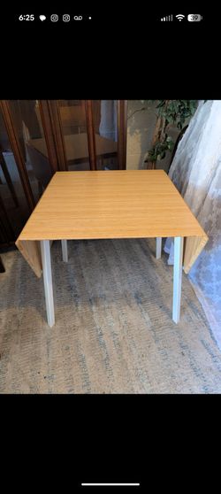 Light Wood Drop Leaf Table with White Legs