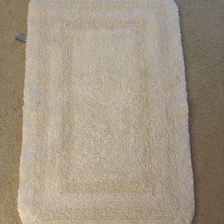Rug 24” wide x 36” long - Cream color, Made in India,  Washable, Both sides of the rug are the same.