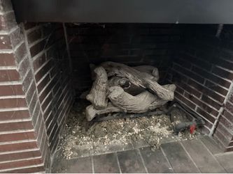 Driftwood log set gas indoors distribution