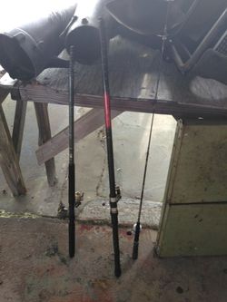 2 20 foot fishing poles practically new with open face rat rods reels