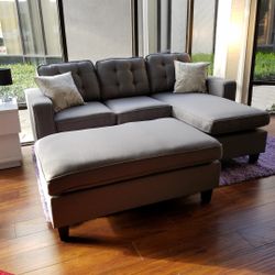 Medium grey sofa with reversible chaise, ottoman, and throw pillows!