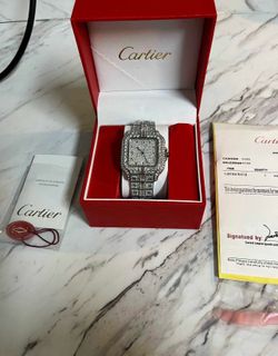 Iced out Cartier watch