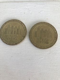 (2) 1997 New York, New York, hotel and casino gaming token one dollar Las Vegas