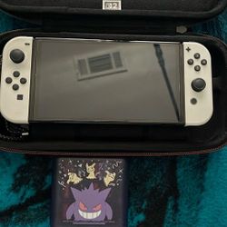 Nintendo Switch OLED  (games and both cases sold separately)