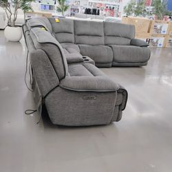 Grey fabric power reclining sectional sofa .