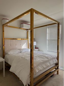 King size Gold Metal Canopy Bed with an upholstered button-tufted headboard