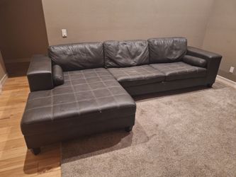 Free .. Leather sectional couch with pull out bed